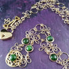THE CELTIC PRIESTESS LOCKING BELT features chain links inspired by Celtic knots, all created entirely by hand using only a few hand tools. The links are then tumbled with steel shot, creating strength and durability, as well as a silky smoothness. Chrome Diopside and Gold Filled Links. By My Secret Heart Studios