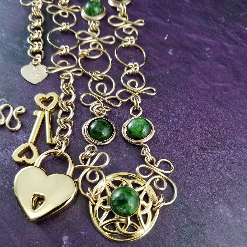 THE CELTIC PRIESTESS LOCKING BELT features chain links inspired by Celtic knots, all created entirely by hand using only a few hand tools. The links are then tumbled with steel shot, creating strength and durability, as well as a silky smoothness. Chrome Diopside and Gold Filled Links. By My Secret Heart Studios