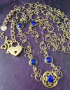 THE CELTIC PRIESTESS LOCKING BELT features chain links inspired by Celtic knots, all created entirely by hand using only a few hand tools. The links are then tumbled with steel shot, creating strength and durability, as well as a silky smoothness. Lapis Lazuli and Gold Filled. By My Secret Heart Studios
