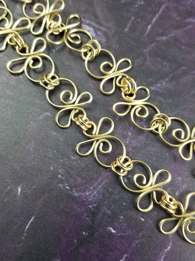 Made a bold statement of your Dominant / submissive lifestyle. The CELTIC PRIESTESS locking submissive collar features chain links inspired by Celtic knots, all created entirely by hand using only a few hand tools. The links are then tumbled with steel shot, creating strength and durability, as well as a silky smoothness. 