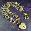 Made a bold statement of your Dominant / submissive lifestyle. The CELTIC PRIESTESS locking submissive collar features chain links inspired by Celtic knots, all created entirely by hand using only a few hand tools. The links are then tumbled with steel shot, creating strength and durability, as well as a silky smoothness. 