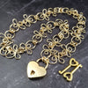 Made a bold statement of your Dominant / submissive lifestyle. The CELTIC PRIESTESS locking submissive collar features chain links inspired by Celtic knots, all created entirely by hand using only a few hand tools. The links are then tumbled with steel shot, creating strength and durability, as well as a silky smoothness. 