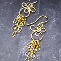 The CELTIC PRIESTESS earrings feature chain links inspired by Celtic knots, all created entirely by hand using only a few hand tools. 