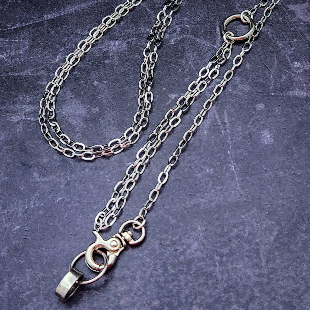 A sleek and simple chain collar of Stainless Steel gets it done. The handle is 10 inches of chain, so both small and large hands should fit easily. The 36 inch chain ends with a silver tone swivel trigger clip. Features a handcrafted sterling O Ring with a bail opening large enough to fit most all of our collars.