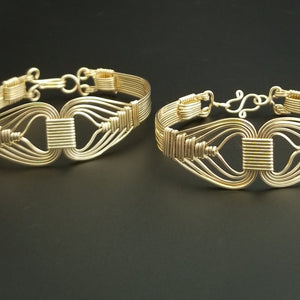 Wire wrapped 14k Gold Filled bracelet inspired by the Egyptian Queen Cleopatra. This locking submissive bracelet is bold and contemporary, and totally discreet for day wear. ORDER A PAIR for stunning handcuffs bracelets or one for sub and one for Dominant. {maybe even chained together!}