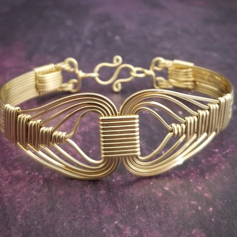 Wire wrapped 14k Gold Filled bracelet inspired by the Egyptian Queen Cleopatra. This locking submissive bracelet is bold and contemporary, and totally discreet for day wear. ORDER A PAIR for stunning handcuffs bracelets or one for sub and one for Dominant. {maybe even chained together!}