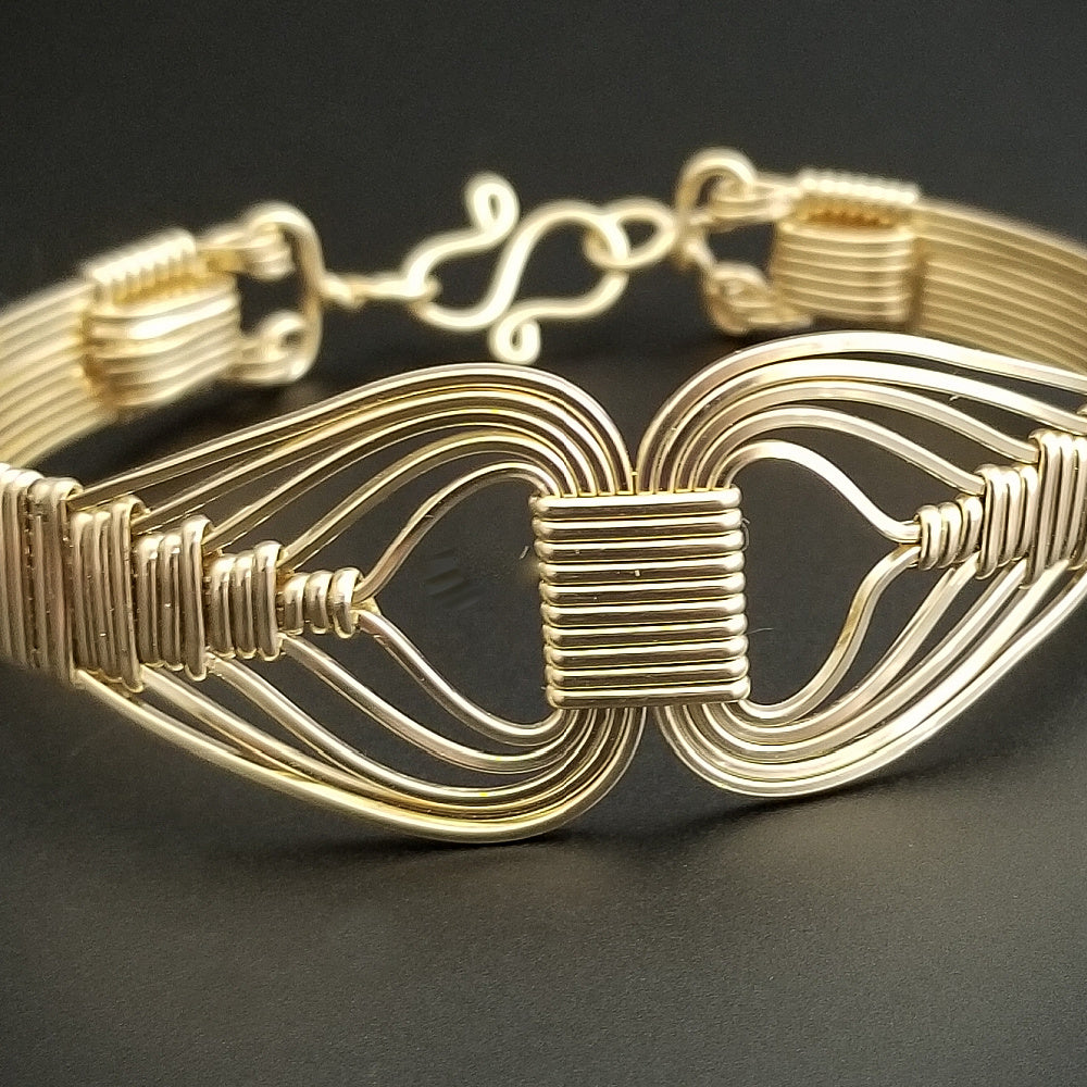 Wire wrapped 14k Gold Filled bracelet inspired by the Egyptian Queen Cleopatra. This locking submissive bracelet is bold and contemporary, and totally discreet for day wear. ORDER A PAIR for stunning handcuffs bracelets or one for sub and one for Dominant. {maybe even chained together!}
