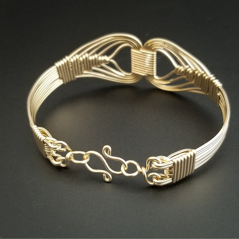 Wire wrapped 14k Gold Filled bracelet inspired by the Egyptian Queen Cleopatra. This locking submissive bracelet is bold and contemporary, and totally discreet for day wear. ORDER A PAIR for stunning handcuffs bracelets or one for sub and one for Dominant. {maybe even chained together!}
