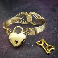 Wire wrapped 14k Gold Filled bracelet inspired by the Egyptian Queen Cleopatra. This locking submissive bracelet is bold and contemporary, and totally discreet for day wear. ORDER A PAIR for stunning handcuffs bracelets or one for sub and one for Dominant. {maybe even chained together!}