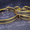 The AMARI BOLD Locking Submissive Bracelet or Anklet, crafted from blackened sterling silver and gold-filled wire, provides a sophisticated, exclusive accent for those who embrace the power of submission. A limited release for the boldest of BDSM boudoirs.