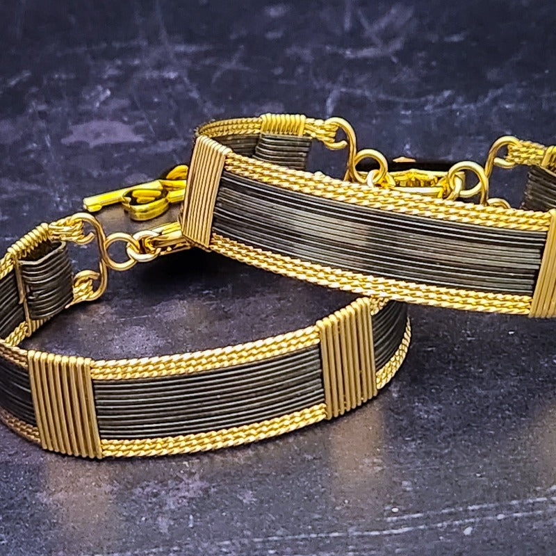 The AMARI BOLD Locking Submissive Bracelet or Anklet, crafted from blackened sterling silver and gold-filled wire, provides a sophisticated, exclusive accent for those who embrace the power of submission. A limited release for the boldest of BDSM boudoirs. Limited Release