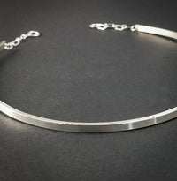  A Celtic inspired locking submissive collar that's sleek and clean in the front, and embellished with Celtic knots in the back. Or... reverse it and wear the decorative design in the front with the lock, for a bold statement of Ownership. Since it's unadorned in the front, you can easily change the look with collar enhancers / slides.