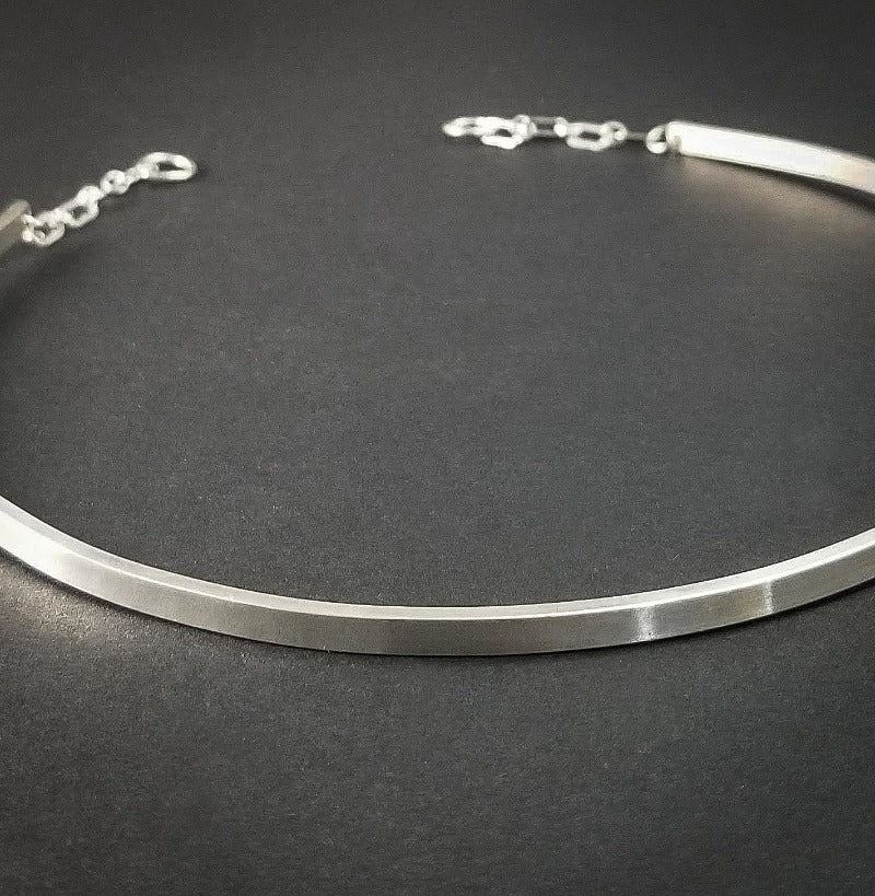  A Celtic inspired locking submissive collar that's sleek and clean in the front, and embellished with Celtic knots in the back. Or... reverse it and wear the decorative design in the front with the lock, for a bold statement of Ownership. Since it's unadorned in the front, you can easily change the look with collar enhancers / slides.