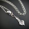 Nature Inspired. Graceful and timeless. This locking submissive BDSM soft collar is the epitome of discretion. The Calla Lily hangs from a sterling chain, but can be removed and slipped onto several of our MSHS submissive collars. Or the 'slide' can also be worn on chains, leather, ribbon, etc. Three versions available: Traditional, Permanently Locking or Lock and Key.