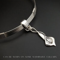 Nature Inspired. Graceful and timeless. This locking submissive BDSM soft collar is the epitome of discretion. The Calla Lily hangs from a sterling chain, but can be removed and slipped onto several of our MSHS submissive collars. Or the 'slide' can also be worn on chains, leather, ribbon, etc. Three versions available: Traditional, Permanently Locking or Lock and Key.