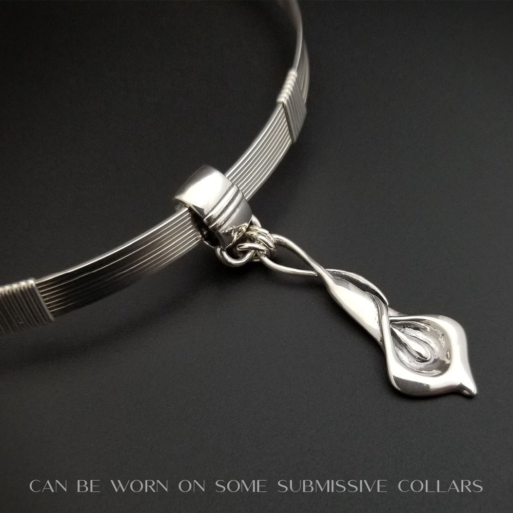 Nature Inspired. Graceful and timeless. This locking submissive BDSM soft collar is the epitome of discretion. The Calla Lily hangs from a sterling chain, but can be removed and slipped onto several of our MSHS submissive collars. Or the 'slide' can also be worn on chains, leather, ribbon, etc. Three versions available: Traditional, Permanently Locking or Lock and Key.