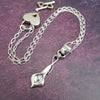 Nature Inspired. Graceful and timeless. This locking submissive BDSM soft collar is the epitome of discretion. The Calla Lily hangs from a sterling chain, but can be removed and slipped onto several of our MSHS submissive collars. Or the 'slide' can also be worn on chains, leather, ribbon, etc. Three versions available: Traditional, Permanently Locking or Lock and Key.