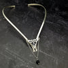 Inspired by campfires, music and moonlight dancing. Ancient past, present and future. Substantial open back style collar has a nice fluid curve that hugs the neck. Celtic knot with swag chain and black onyx bead. Created in all luxurious sterling silver, its solid, weighty construction makes it a timeless piece that you'll be able to enjoy for years to come. My Secret Heart Studios