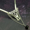 Inspired by campfires, music and moonlight dancing. Ancient past, present and future. Substantial open back style collar has a nice fluid curve that hugs the neck. Celtic knot with swag chain and black onyx bead. Created in all luxurious sterling silver, its solid, weighty construction makes it a timeless piece that you'll be able to enjoy for years to come. My Secret Heart Studios