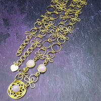 THE CELTIC PRIESTESS MEDALLION BELT features chain links inspired by Celtic knots, all created entirely by hand using luxurious 14K Gold Filled wire and hand selected gemstone cabochons.