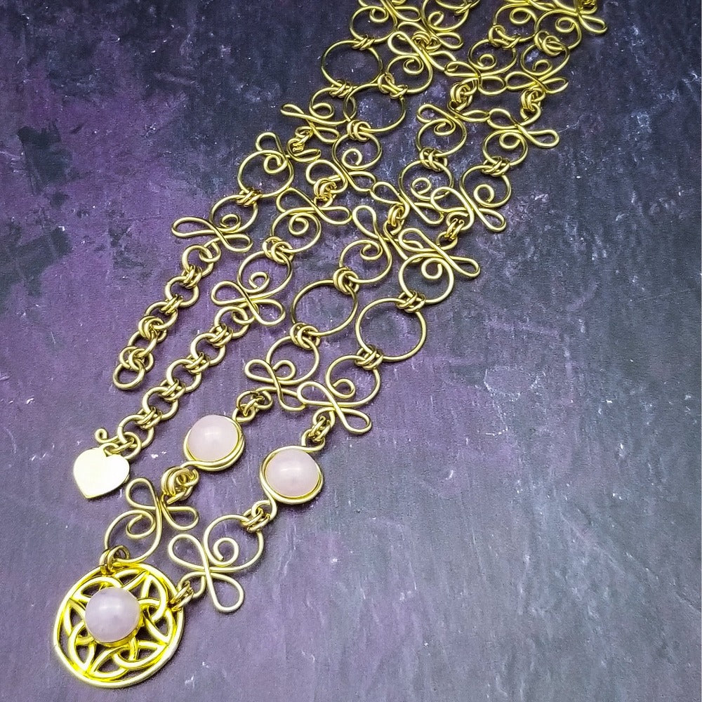 THE CELTIC PRIESTESS MEDALLION BELT features chain links inspired by Celtic knots, all created entirely by hand using luxurious 14K Gold Filled wire and hand selected gemstone cabochons.