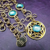 THE CELTIC PRIESTESS MEDALLION BELT features chain links inspired by Celtic knots, all created entirely by hand using luxurious 14K Gold Filled wire and hand selected gemstone cabochons. 