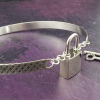 Our Darkenwald design is reminiscent of old castle walls, knights on galloping horses and laughter and ale in the great hall by firelight.  Substantial sterling silver collar accommodates a traditional clasp for discretion, but can also be worn with a padlock and key for a big statement of Ownership.