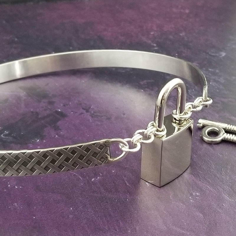 Our Darkenwald design is reminiscent of old castle walls, knights on galloping horses and laughter and ale in the great hall by firelight.  Substantial sterling silver collar accommodates a traditional clasp for discretion, but can also be worn with a padlock and key for a big statement of Ownership.