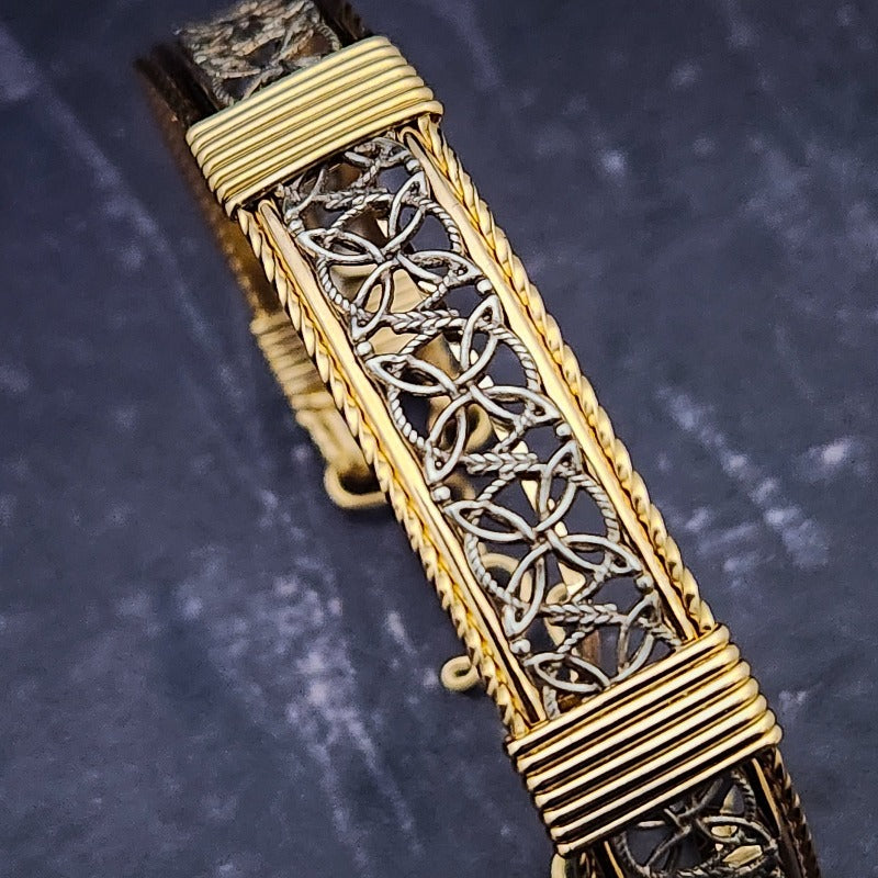 Dekka's BDSM Submissive Handcuff Bracelets or Anklets feature sterling silver lattice work with delicate precious metal accents for a luxurious, daring look. With its intricate design, these bracelets or anklets communicate Ownership in a stylish, understated way.