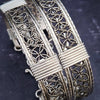 Dekka's BDSM Submissive Handcuff Bracelets or Anklets feature sterling silver lattice work with delicate precious metal accents for a luxurious, daring look. With its intricate design, these bracelets or anklets communicate Ownership in a stylish, understated way.