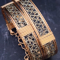Dekka's BDSM Submissive Handcuff Bracelets or Anklets feature sterling silver lattice work with delicate precious metal accents for a luxurious, daring look. With its intricate design, these bracelets or anklets communicate Ownership in a stylish, understated way.