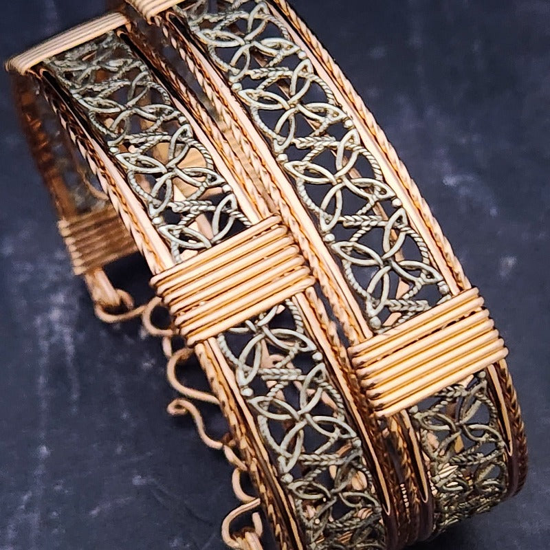 Dekka's BDSM Submissive Handcuff Bracelets or Anklets feature sterling silver lattice work with delicate precious metal accents for a luxurious, daring look. With its intricate design, these bracelets or anklets communicate Ownership in a stylish, understated way.