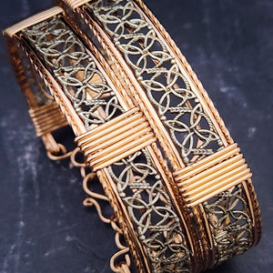 Dekka's BDSM Submissive Handcuff Bracelets or Anklets feature sterling silver lattice work with delicate precious metal accents for a luxurious, daring look. With its intricate design, these bracelets or anklets communicate Ownership in a stylish, understated way.