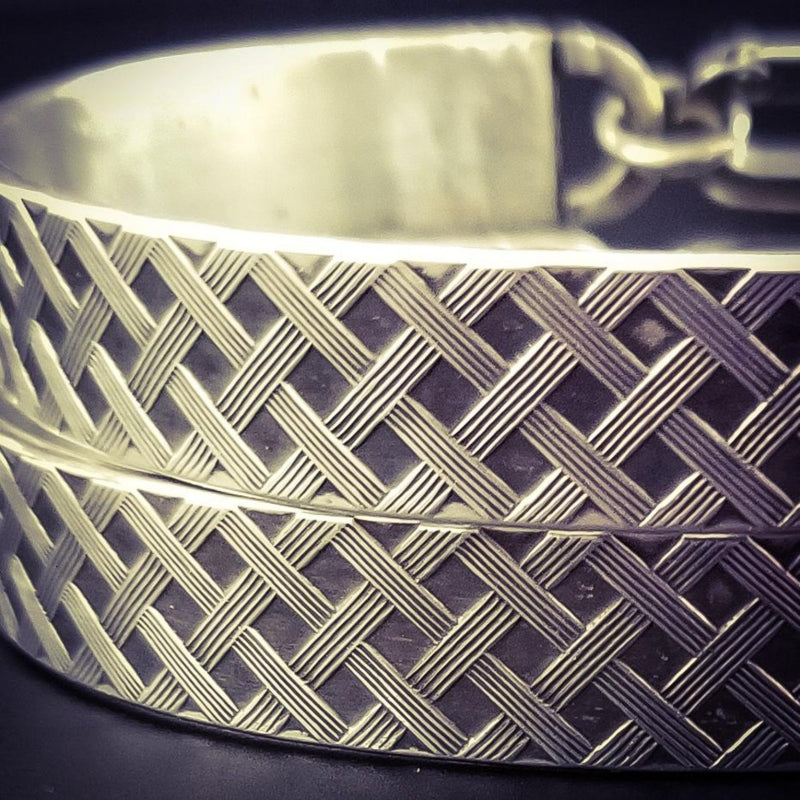 Boldly state your BDSM lifestyle with the Darkenwald cuffs / anklets. Our Darkenwald design is reminiscent of old castle walls, knights on galloping horses and laughter and ale in the great hall by firelight.  Substantial sterling silver cuffs accommodate a traditional clasp for discretion, but can also be worn with a padlock and key for a big statement of Ownership. Nice hefty bracelets for a lifetime of play and pleasure.