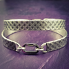 Boldly state your BDSM lifestyle with the Darkenwald cuffs / anklets. Our Darkenwald design is reminiscent of old castle walls, knights on galloping horses and laughter and ale in the great hall by firelight.  Substantial sterling silver cuffs accommodate a traditional clasp for discretion, but can also be worn with a padlock and key for a big statement of Ownership. Nice hefty bracelets for a lifetime of play and pleasure.