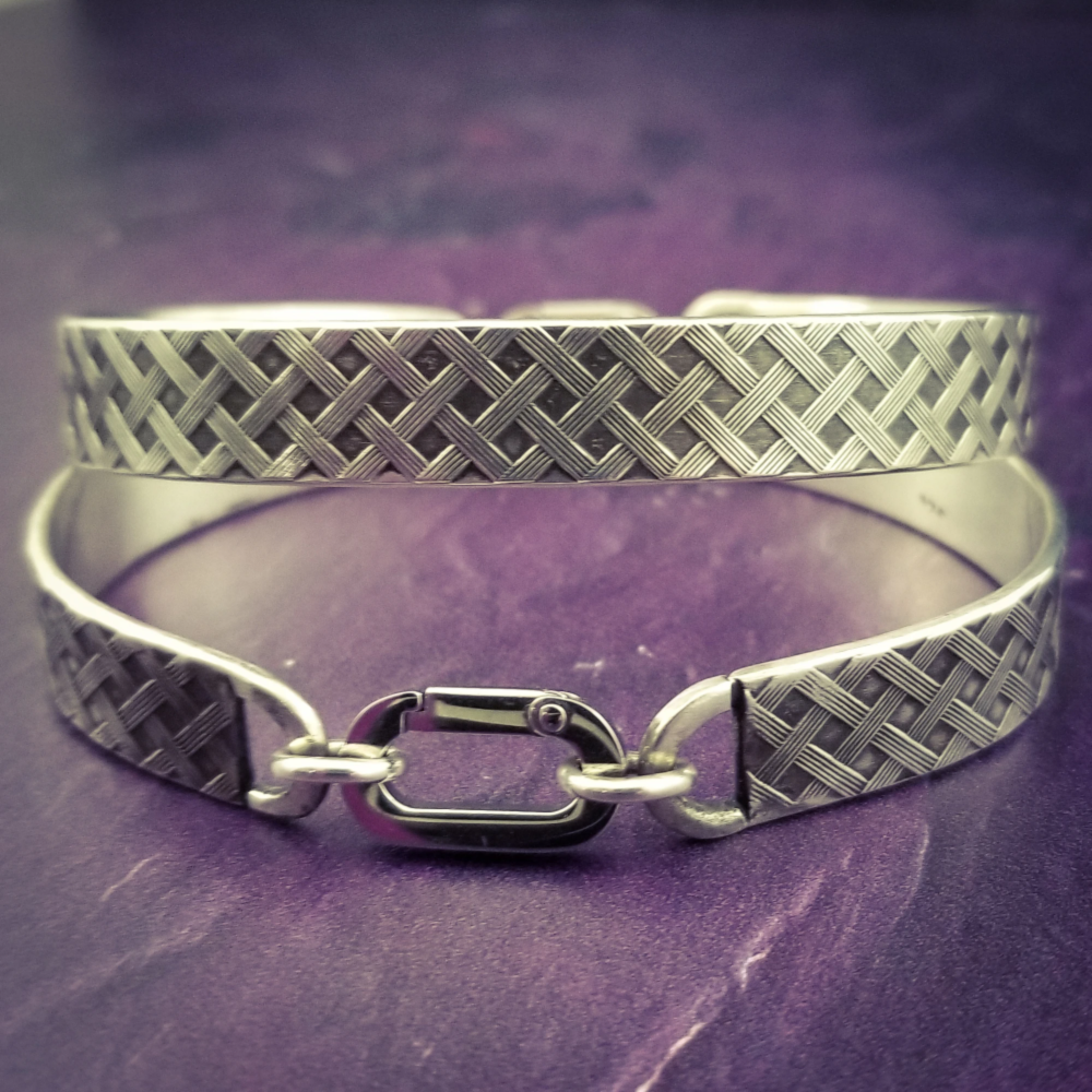 Boldly state your BDSM lifestyle with the Darkenwald cuffs / anklets. Our Darkenwald design is reminiscent of old castle walls, knights on galloping horses and laughter and ale in the great hall by firelight.  Substantial sterling silver cuffs accommodate a traditional clasp for discretion, but can also be worn with a padlock and key for a big statement of Ownership. Nice hefty bracelets for a lifetime of play and pleasure.