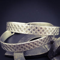 Boldly state your BDSM lifestyle with the Darkenwald cuffs / anklets. Our Darkenwald design is reminiscent of old castle walls, knights on galloping horses and laughter and ale in the great hall by firelight.  Substantial sterling silver cuffs accommodate a traditional clasp for discretion, but can also be worn with a padlock and key for a big statement of Ownership. Nice hefty bracelets for a lifetime of play and pleasure.