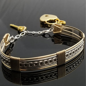 This sterling silver Key Cuff is created with a detachable chain that holds the key to Your slave or sub's locked collars or cuffs. Jewelry clasps clip into rings that attach to the cuff, which makes removing the chain simple. 