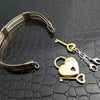 This sterling silver Key Cuff is created with a detachable chain that holds the key to Your slave or sub's locked collars or cuffs. Jewelry clasps clip into rings that attach to the cuff, which makes removing the chain simple. 