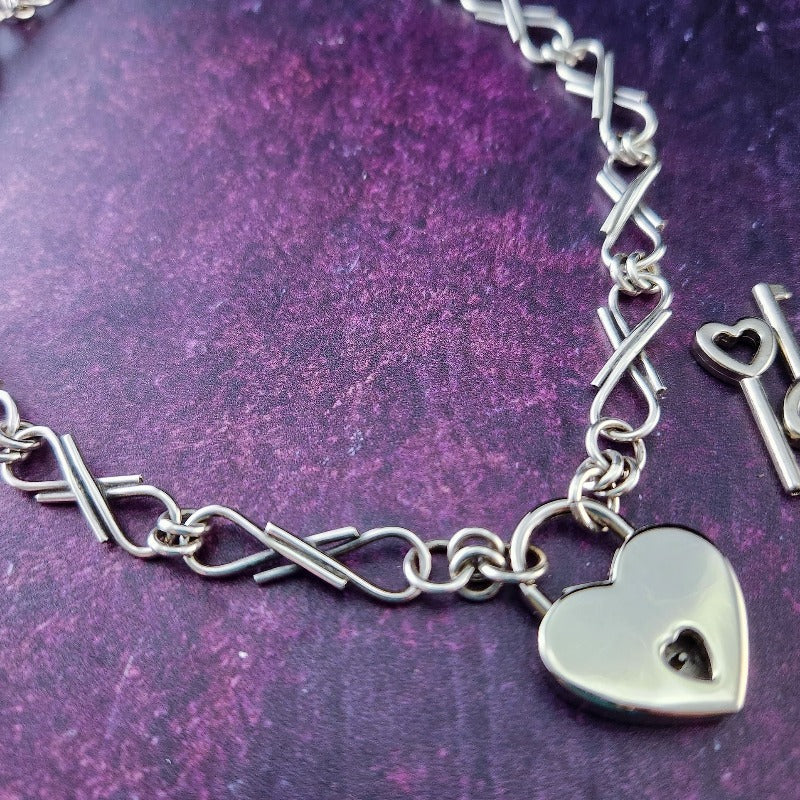 We've all fought battles. And won. I created Embrace to honor the battles. The handcrafted links are interlocked and symbolize the power of love and prayer. The power of loved ones and friends that stand by  you during your raging storms. Choose from a locking submissive style or traditional.