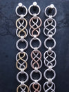 Beautifully entwined lives. Eternal Chains are symbolic of your journey. Featuring chain links inspired by Celtic knots, all created entirely by hand using only a few hand tools. The links are then tumbled with steel shot, creating strength and durability, as well as a silky smoothness. Made a bold statement of your Dominant / submissive or BDSM lifestyle.