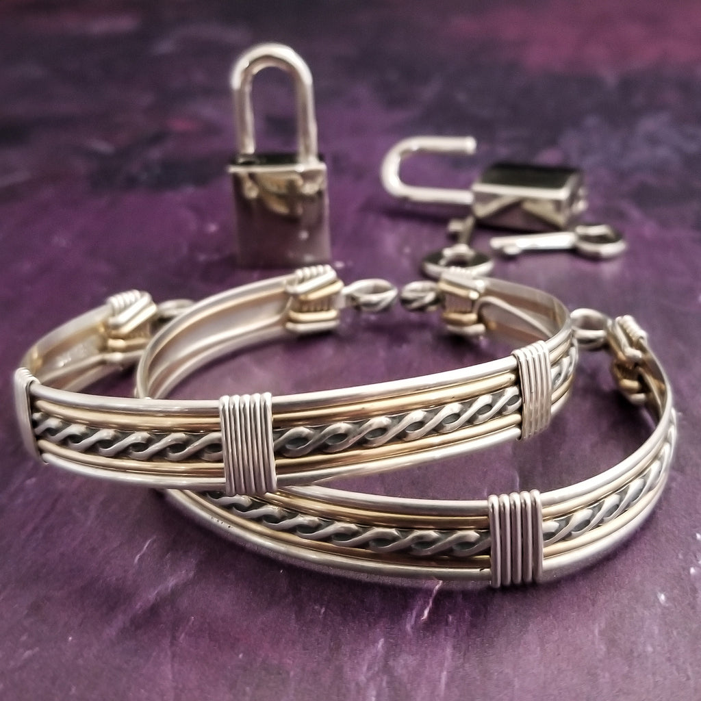 Our Entwined Collection is themed around ropes, paying homage to the ancient art of shibari. These locking BDSM submissive bracelets are so beautifully discreet.  Created in sterling with slim bands of 14k gold filled accents. Can be worn as wrist or ankle restraints.  