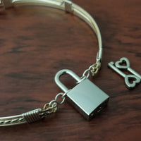 Sterling submissive collar that is discreet for daytime, yet kinky for playtime. The Celtic inspired design features a rope pattern, with accent lines of sterling and 14k gold filled, all wrapped together with sterling wraps. 