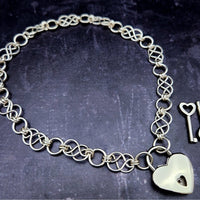 Beautifully entwined lives. Eternal Chains are symbolic of your journey. Featuring chain links inspired by Celtic knots, all created entirely by hand using only a few hand tools. The links are then tumbled with steel shot, creating strength and durability, as well as a silky smoothness. Made a bold statement of your Dominant / submissive or BDSM lifestyle.