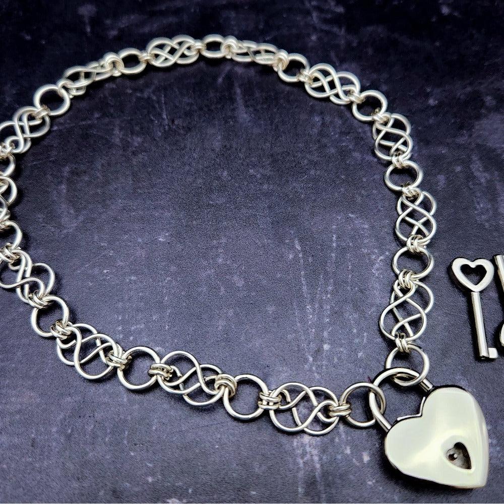 Beautifully entwined lives. Eternal Chains are symbolic of your journey. Featuring chain links inspired by Celtic knots, all created entirely by hand using only a few hand tools. The links are then tumbled with steel shot, creating strength and durability, as well as a silky smoothness. Made a bold statement of your Dominant / submissive or BDSM lifestyle.