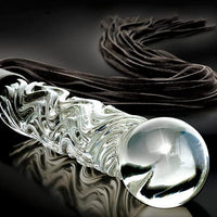 Achieve the ideal combination of bliss and agony with this BDSM Flogger, crafted of Black Suede and Glass. This timeless impact toy is stylish, opulent, and made with great attention to detail. Customize it your way and experience the range of sensations that come with S&M play from gentle warmth to hard hits. Can be engraved / monogrammed. By My Secret Heart Studios