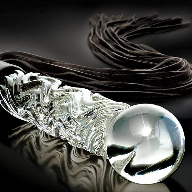 Achieve the ideal combination of bliss and agony with this BDSM Flogger, crafted of Black Suede and Glass. This timeless impact toy is stylish, opulent, and made with great attention to detail. Customize it your way and experience the range of sensations that come with S&M play from gentle warmth to hard hits. Can be engraved / monogrammed. By My Secret Heart Studios