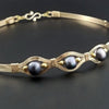 Luxurious gold surrounds large freshwater pearls in an exotic peacock color {blues and greens} in this submissive locking BDSM collar. It's bold, yet delicate and oh so feminine. Show your ownership or submission with beauty and grace.