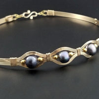 Luxurious gold surrounds large freshwater pearls in an exotic peacock color {blues and greens} in this submissive locking BDSM collar. It's bold, yet delicate and oh so feminine. Show your ownership or submission with beauty and grace.