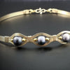 Luxurious gold surrounds large freshwater pearls in an exotic peacock color {blues and greens} in this submissive locking BDSM collar. It's bold, yet delicate and oh so feminine. Show your ownership or submission with beauty and grace.